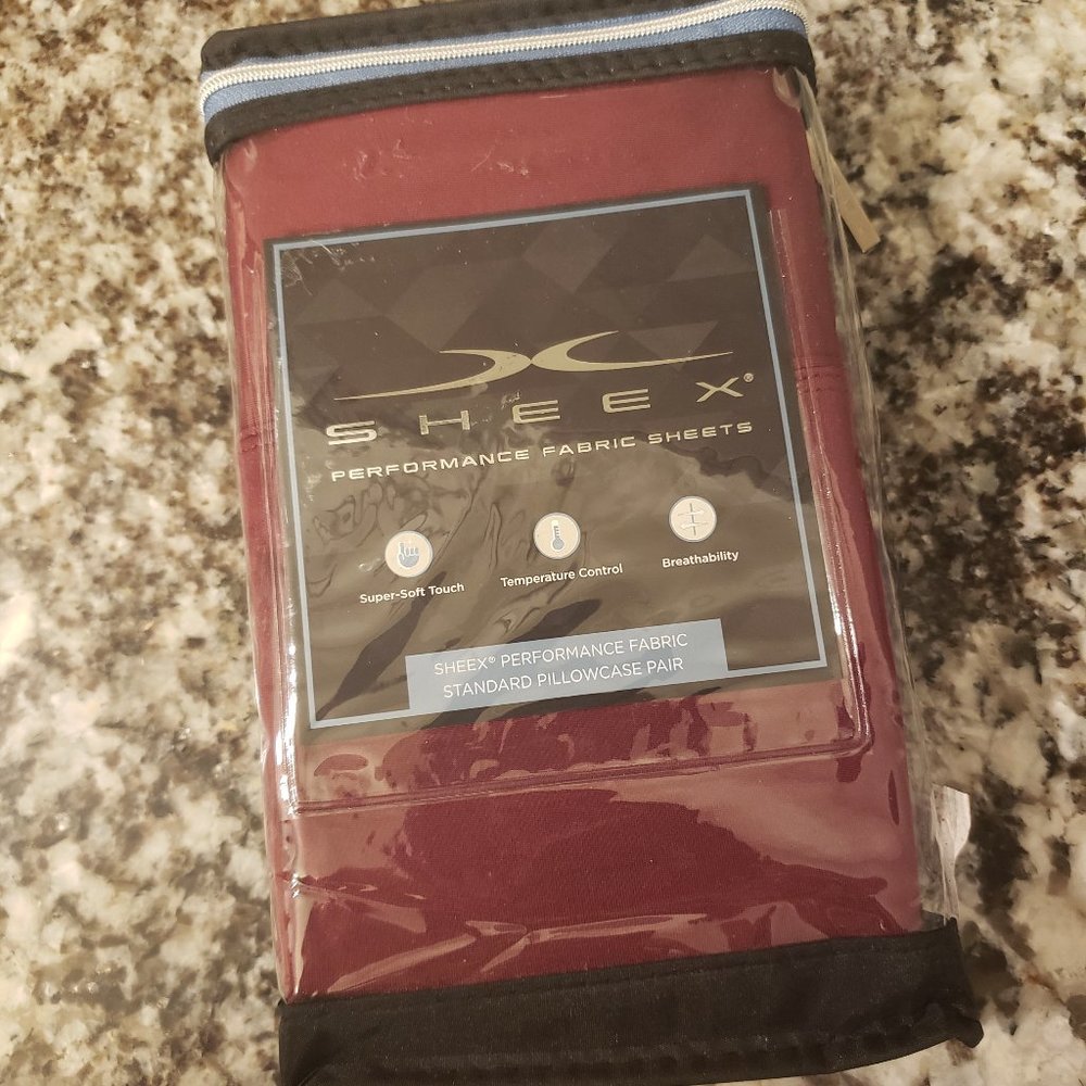 Brand new in package Sheex standard size pillow cases. Color is crimson.